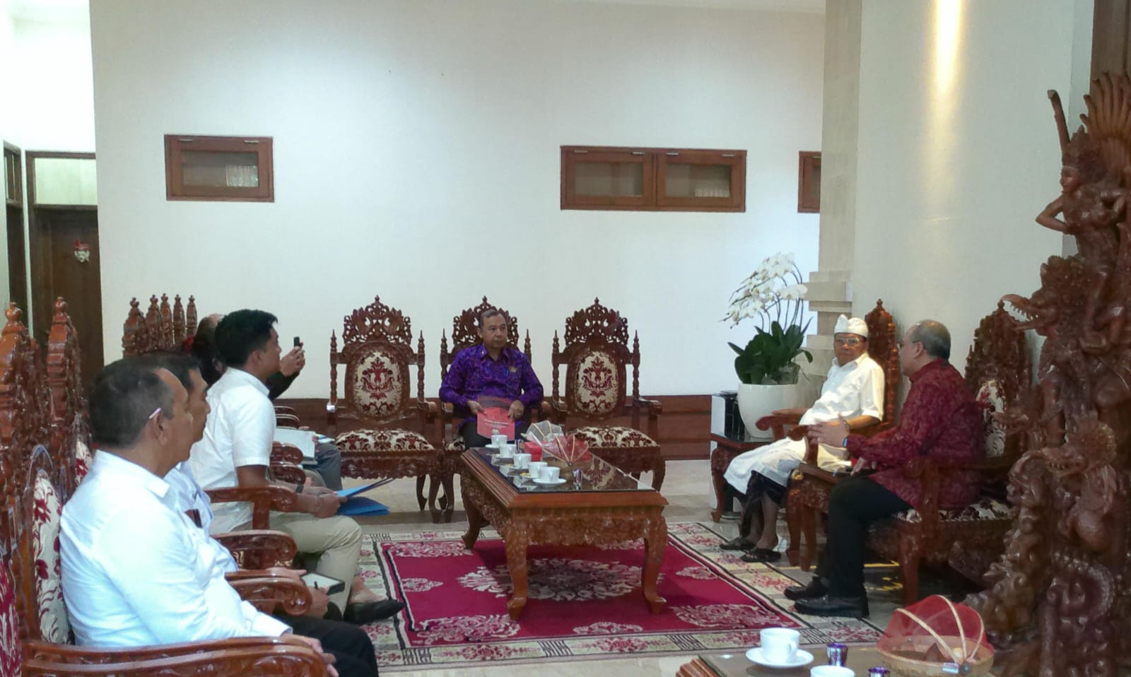 Bali Governor Wayan Koster with Bank Indonesia officials discussing Qris launch and inflation control programs.