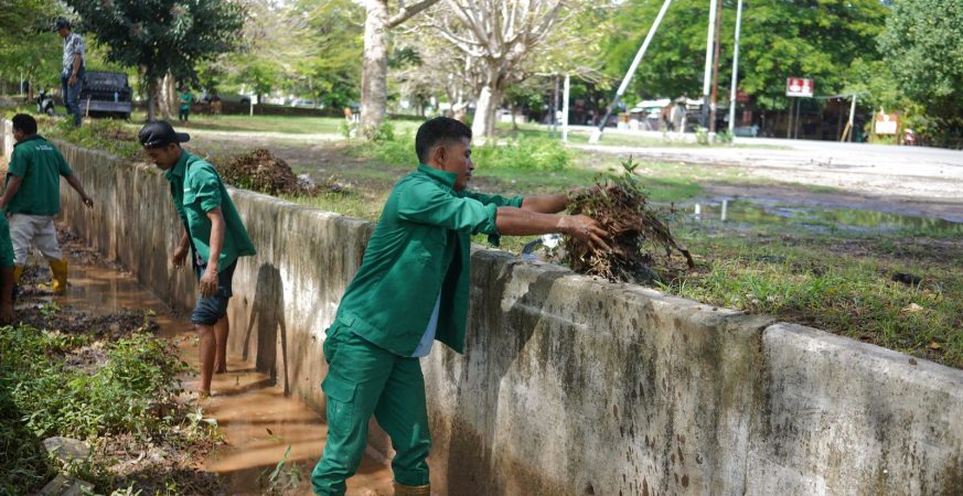 Heavy equipment clearing mud and trash from a drainage channel in the Mandalika Special Economic Zone.